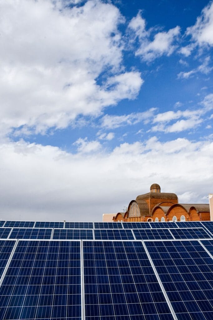 a large building with a lot of solar panels on top of it