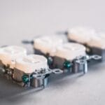 A detailed close-up of electrical outlets. Perfect for construction and electrical use themes.