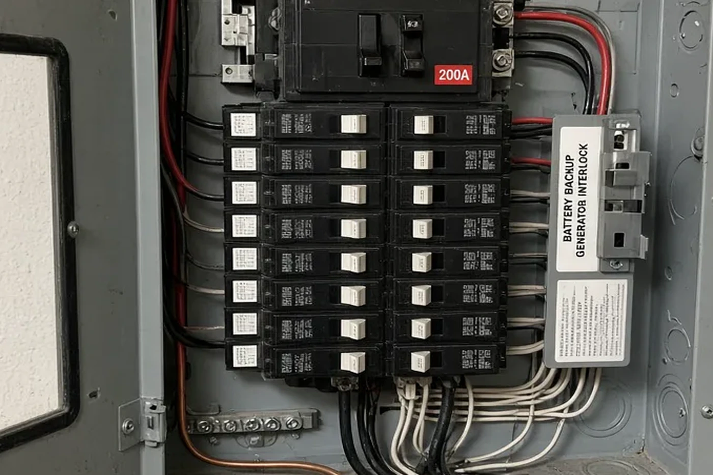 Close view of circuit breakers inside a residential 200-amp panel