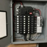 Open 200-amp residential panel with battery backup interlock